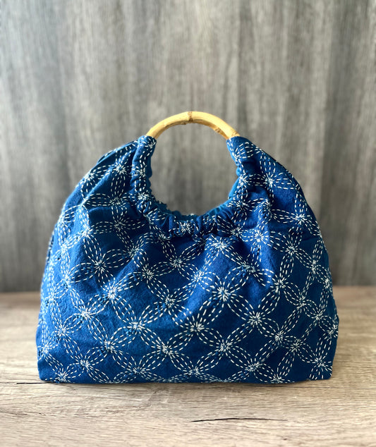 Sashiko indigo dyed handbag with bamboo ring handles. Natural indigo embroidery dumpling-shaped vintage wrist bag for her!