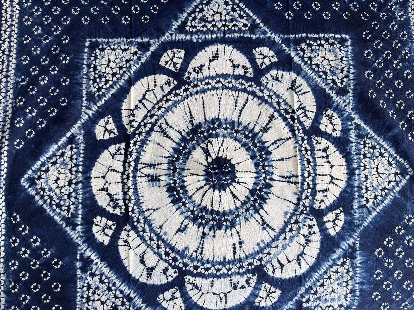 Delicate indigo tie dye floral tablecloth in 90cm*90cm square size. Perfect for coffee table/ bedside table or as a tapestry/ sofa blanket.