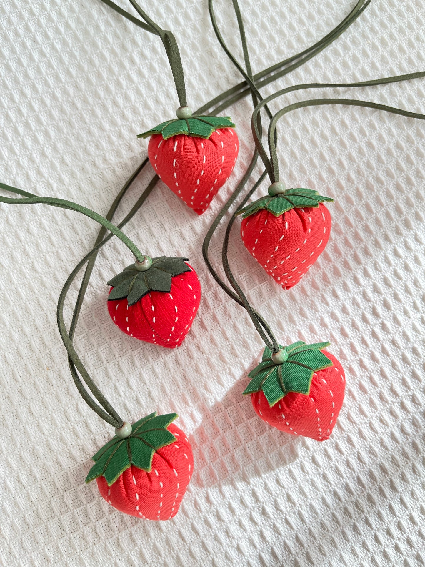 Hand-sewing strawberry shaped sachet with lavender scent. Adjustable length strawberry fabric necklace / bag ornament / car sachet.