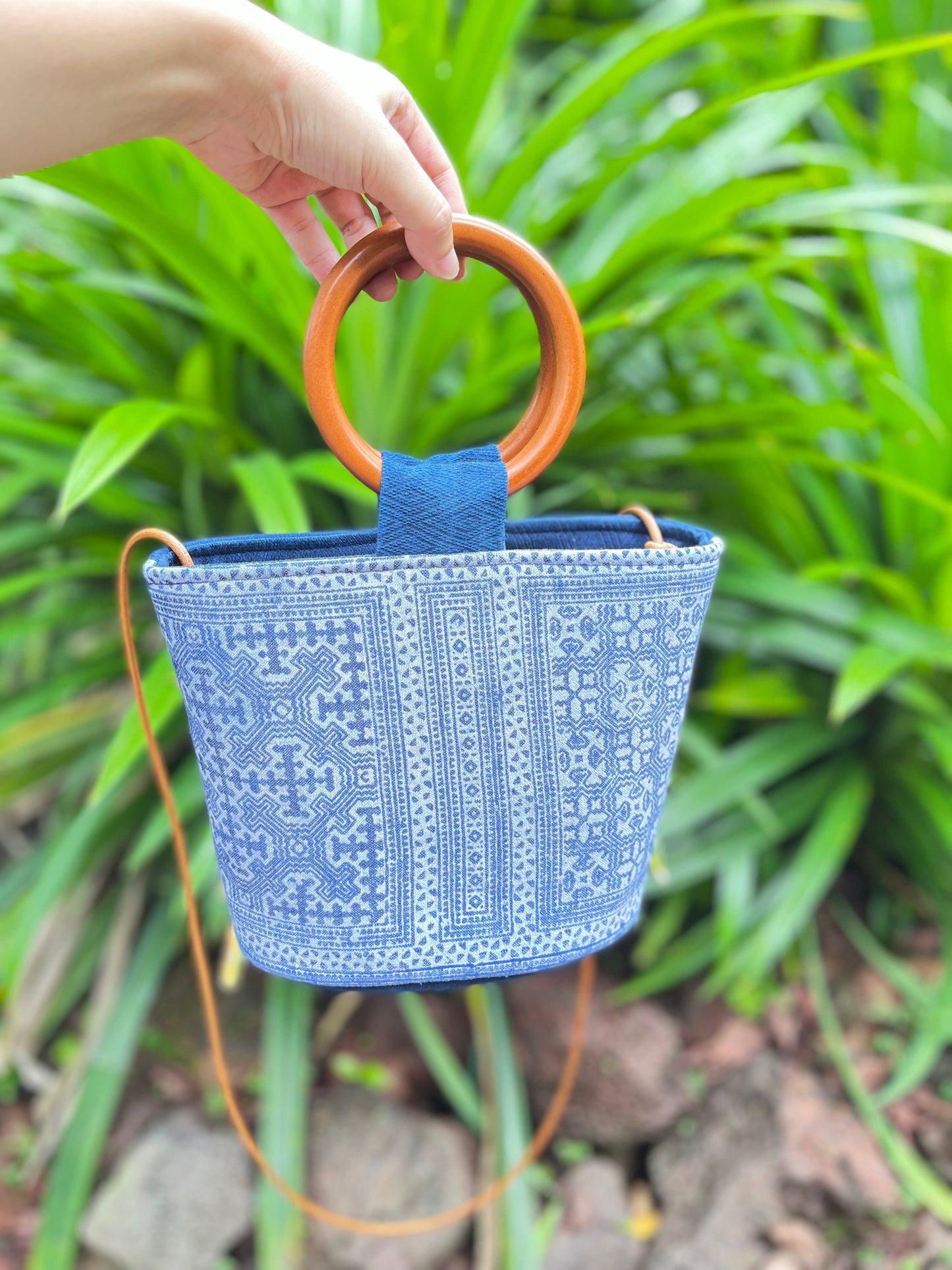 Handwoven vintage linen handle bag in Hmong indigo batik dyed art with solid wood handles. A rustic and ethnic plant dyed messenger bag.